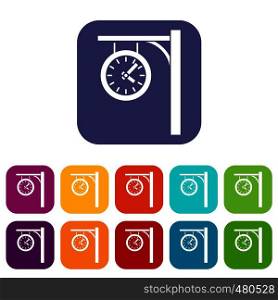 Station clock icons set vector illustration in flat style in colors red, blue, green, and other. Station clock icons set
