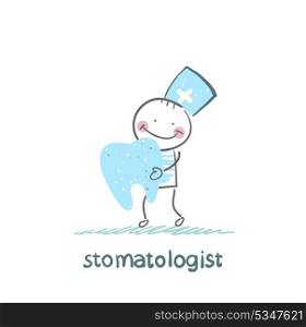 stomatologist holding a tooth