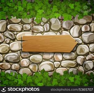 Stone wall with wooden arrow and leaves