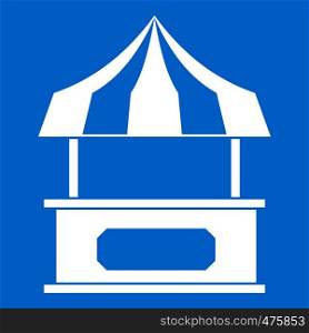 Store kiosk with striped awning icon white isolated on blue background vector illustration. Store kiosk with striped awning icon white