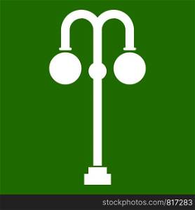 Street lamp icon white isolated on green background. Vector illustration. Street lamp icon green