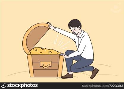 Success wealth and riches concept. Young smiling man sitting and looking at chest full of golden coins hidden treasures money vector illustration . Success wealth and riches concept