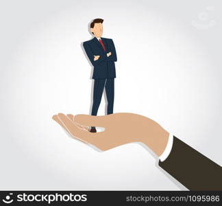 Successful businessman standing with crossed arms in big hand holding