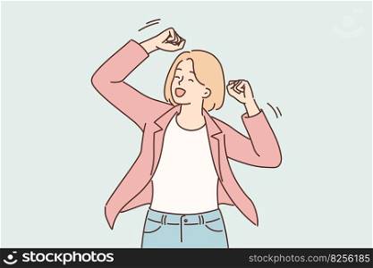 Successful woman raises hands up making victory gesture after learning about promotion or financial triumph of own business. Successful girl dressed in business casual style celebrates achievements . Successful woman raises hands up making victory gesture after triumph of own business