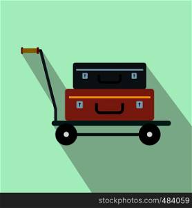 Suitcases on a cart flat icon on a light blue background. Suitcases on a cart flat icon