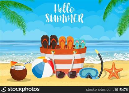 Sun, sparkling ocean and palms. Tropical background with beach bag, flip-flops, sunglasses, starfish and ball on the sandy beach. Sun, sparkling ocean and palms.