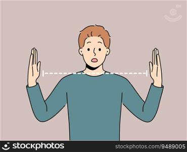 Surprised man spreads arms wide and is shocked by size of object or problem that has arisen. Surprised guy opens mouth and looks at screen, embarrassedly learning about big trouble.. Surprised man spreads arms wide and is shocked by size of object or problem that has arisen