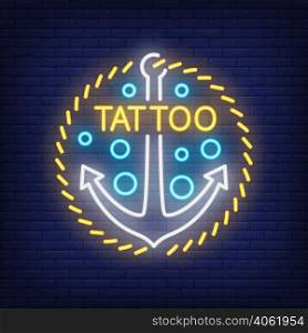 Tattoo neon word and anchor sign. Night bright advertisement, colorful signboard, light banner. Tattoo studio concept. Vector illustration in neon style.