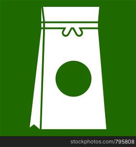 Tea packed in a paper bag icon white isolated on green background. Vector illustration. Tea packed in a paper bag icon green