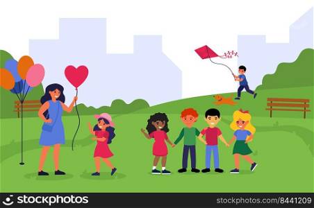 Teacher spending time with preschoolers in park. Woman and children walking together outdoors flat vector illustration. Preschool activity concept for banner, website design or landing web page