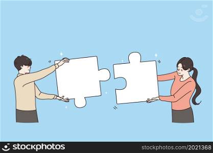 Teamwork, success and collaboration concept. Young man and woman coworkers standing uniting pieces of one puzzle together vector illustration . Teamwork, success and collaboration concept.
