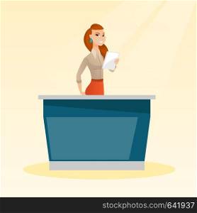 Television anchorwoman working in the studio. Young caucasian television anchorwoman standing at the table in the studio during live broadcasting. Vector flat design illustration. Square layout.. Television anchorwoman in the studio.