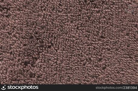 Textured brown towel closeup. Brown towel textures fabric background. Texture brown towel. Brown towel texture background