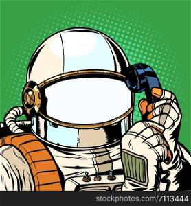 The astronaut is talking on the phone. empty spacesuit template. Pop art retro vector illustration drawing. The astronaut is talking on the phone. empty spacesuit template