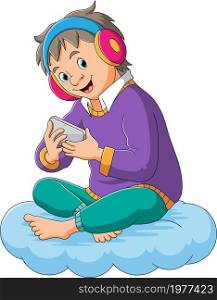 The boy is listening the music with the headphone
