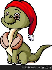 The brontosaurus is wearing the santa hat and neck pillow