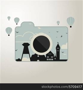 the camera with the image of the houses around balloons