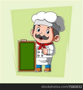 The chef with the white apron holding the green blank board
