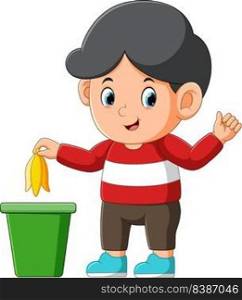 The clean boy is throwing the banana skin into the trash bin 