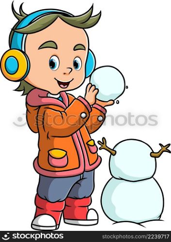 The cool boy is making the snowman with the snow