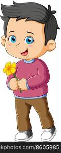 The cute boy is holding the beautiful bright flower