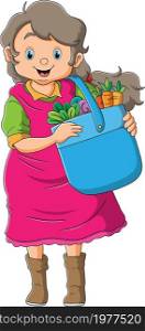 The farmer women is holding a bucket of vegetables