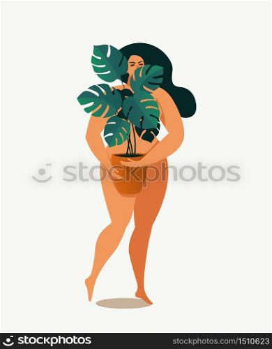 The girl is covered with leaves of home plant.. The girl is covered with leaves of a home plant.