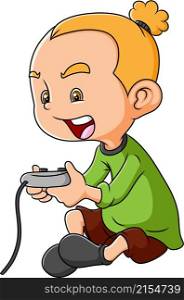 The happy boy is playing the game with the joy stick