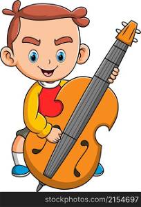 The happy boy playing and holding the big cello