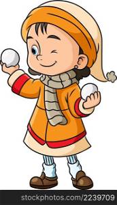 The happy girl is playing the small snowball in the winter season