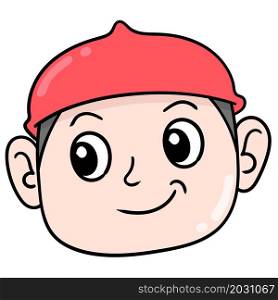 the head of a muslim boy wearing a red cap