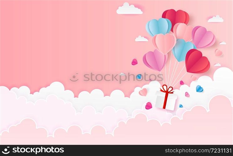 The hot air heart balloon, sun and countryside on pink sky as love, happy valentine's day, wedding and paper art concept