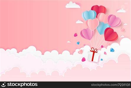 The hot air heart balloon, sun and countryside on pink sky as love, happy valentine's day, wedding and paper art concept