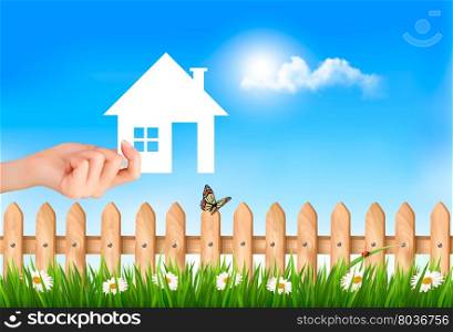 The house in hand on green natural background. Vector.