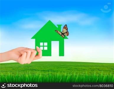 The house in hand on green natural background. Vector.