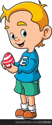 The little boy is holding the egg for the easter celebration