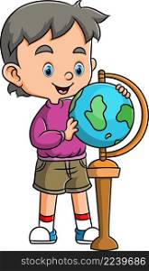The little student is holding and playing the globe