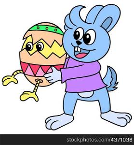 the rabbit carries a colorfully decorated egg for the easter celebration
