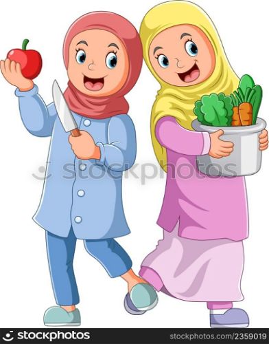 The two girls is holding the fruit and a pail of vegetables
