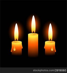 Three candles on a black background
