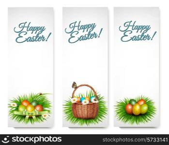 Three Happy Easter banners with easter eggs in a basket and grren grass. Vector.