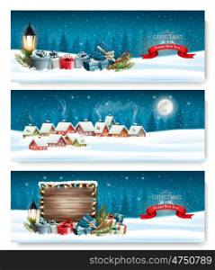 Three Holiday Christmas banners with a winter village and landscape. Vector