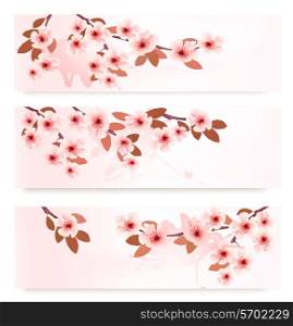 Three spring banners with blossoming branches with pink flowers. Vector illustration.
