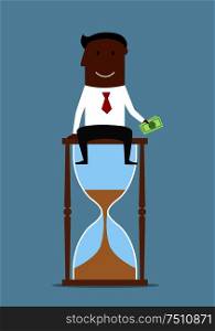 Time is money business concept. Cheerful accomplished businessman sitting on the top of hourglass and holding dollar bills in hand . Businessman sitting with money on hourglass