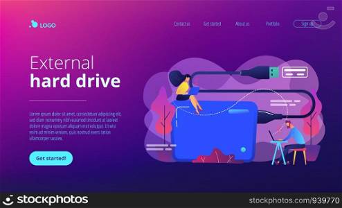 Tiny business people at laptops using portable external hard drive. External hard drive, data storage device, external storage hdd concept. Website vibrant violet landing web page template.. External hard drive concept landing page.