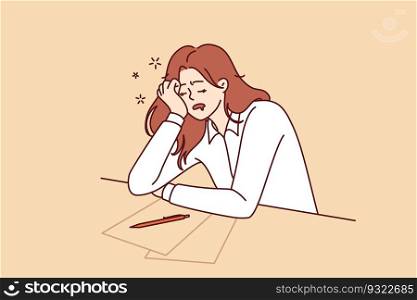 Tired girl student sleeps sitting at table with papers while filling out test or preparing for exams. Concept of burnout and overload during training before college or university entrance exams. Tired girl student sleeps sitting at table with papers while preparing for exams
