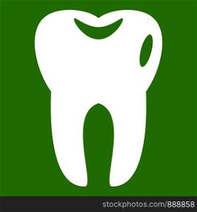 Tooth icon white isolated on green background. Vector illustration. Tooth icon green