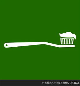Toothbrush icon white isolated on green background. Vector illustration. Toothbrush icon green