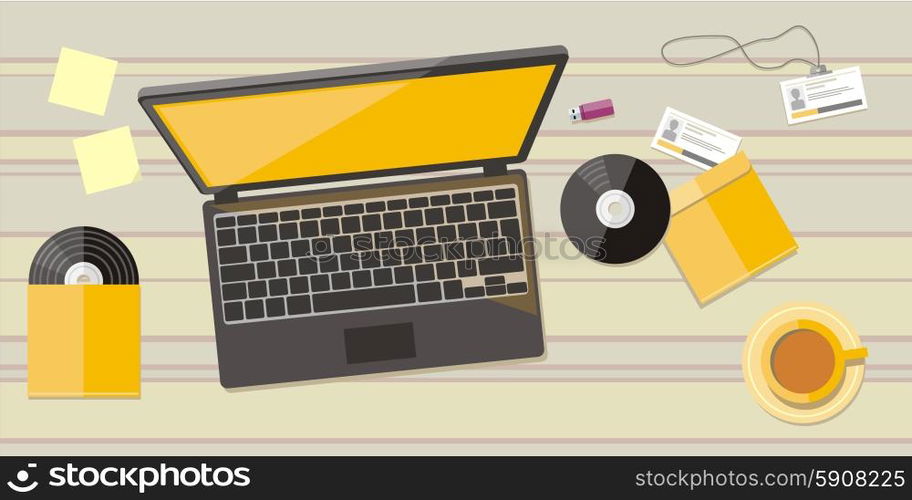 Top view of wood workplace with laptop, cd, badge, cup and documents on wood table