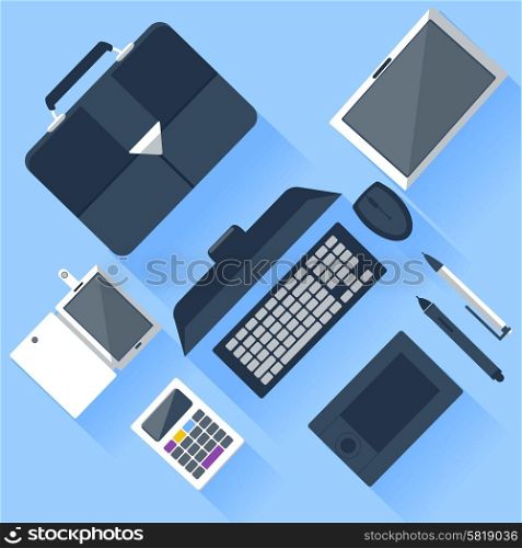 Top view of workplace with laptop, tablet, calculator, smartphone, stationery and documents